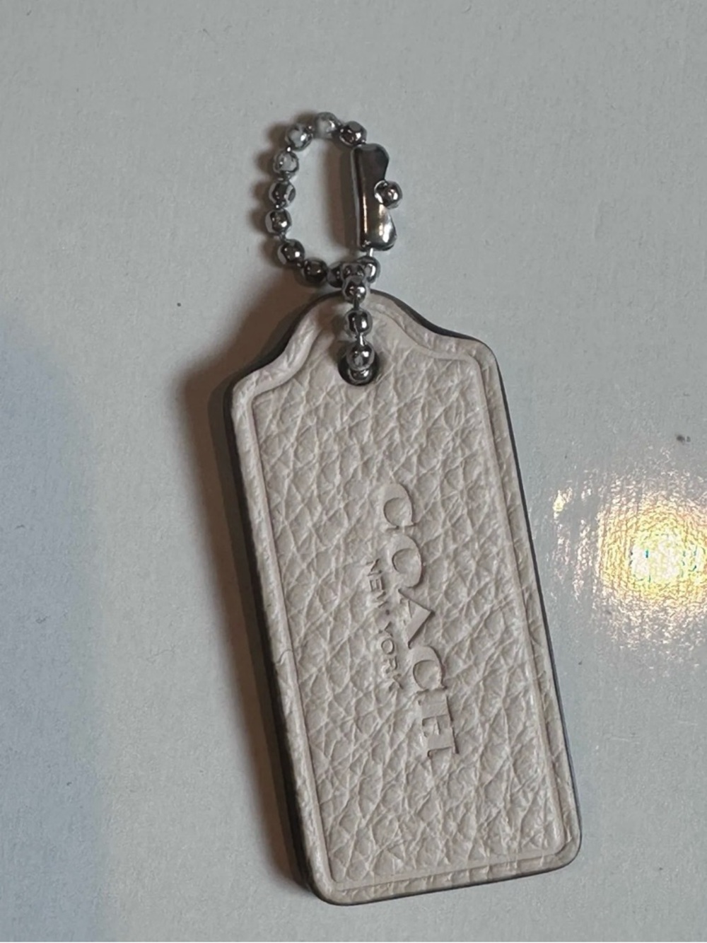 Mini 1.5" Coach New York Hang Tag in Off White Pebbled Leather Keychain
FOB